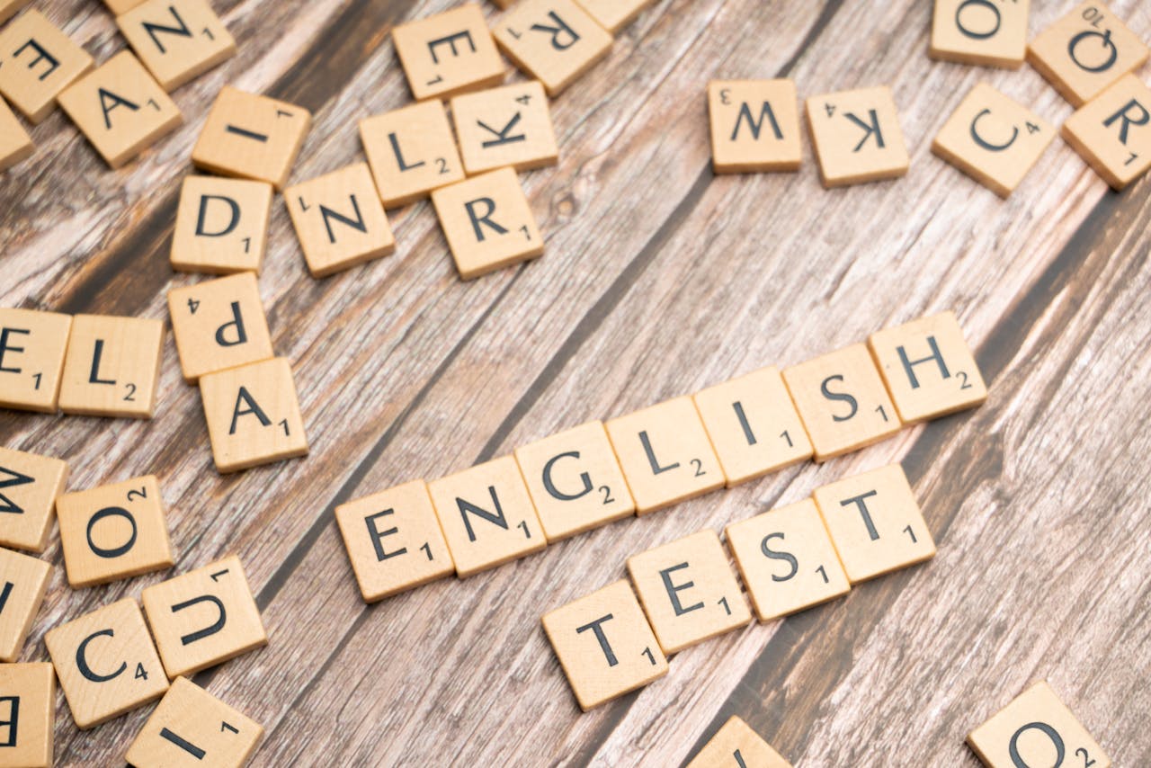 services-04 Wooden Scrabble tiles spelling out 'English Test' on a wooden background, ideal for language exam themes.