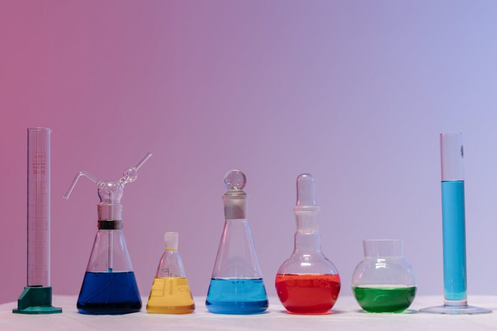 pexels photo 8442641 Vibrant glassware filled with colorful liquids in a laboratory setting.